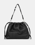 Black leather handbag with drawstring on a light gray background