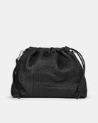 Black leather drawstring bag on a light gray background