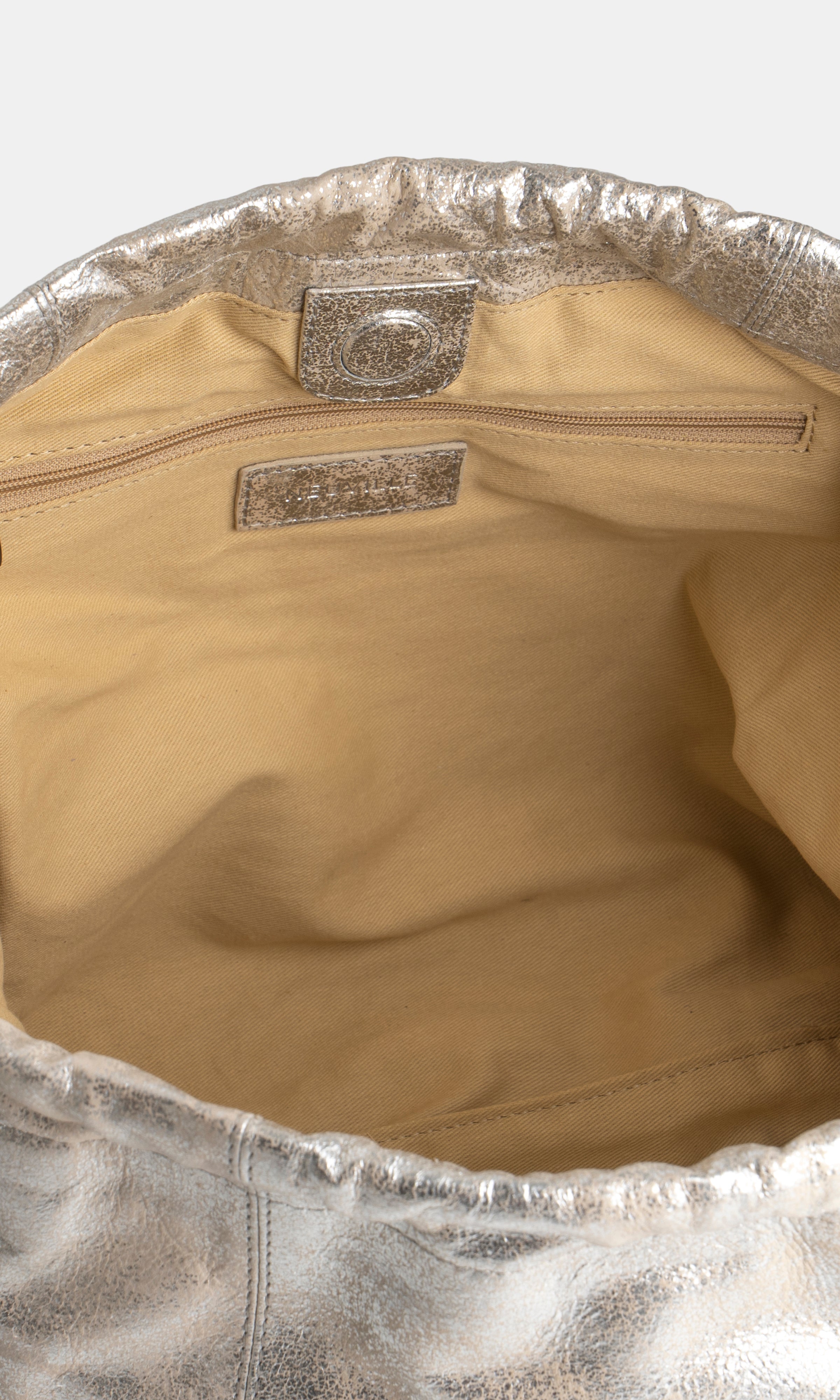 Detailed CLose-up of the inside of a Sand gold Leather shoulder bag. Elliot Sand Gold Neuville