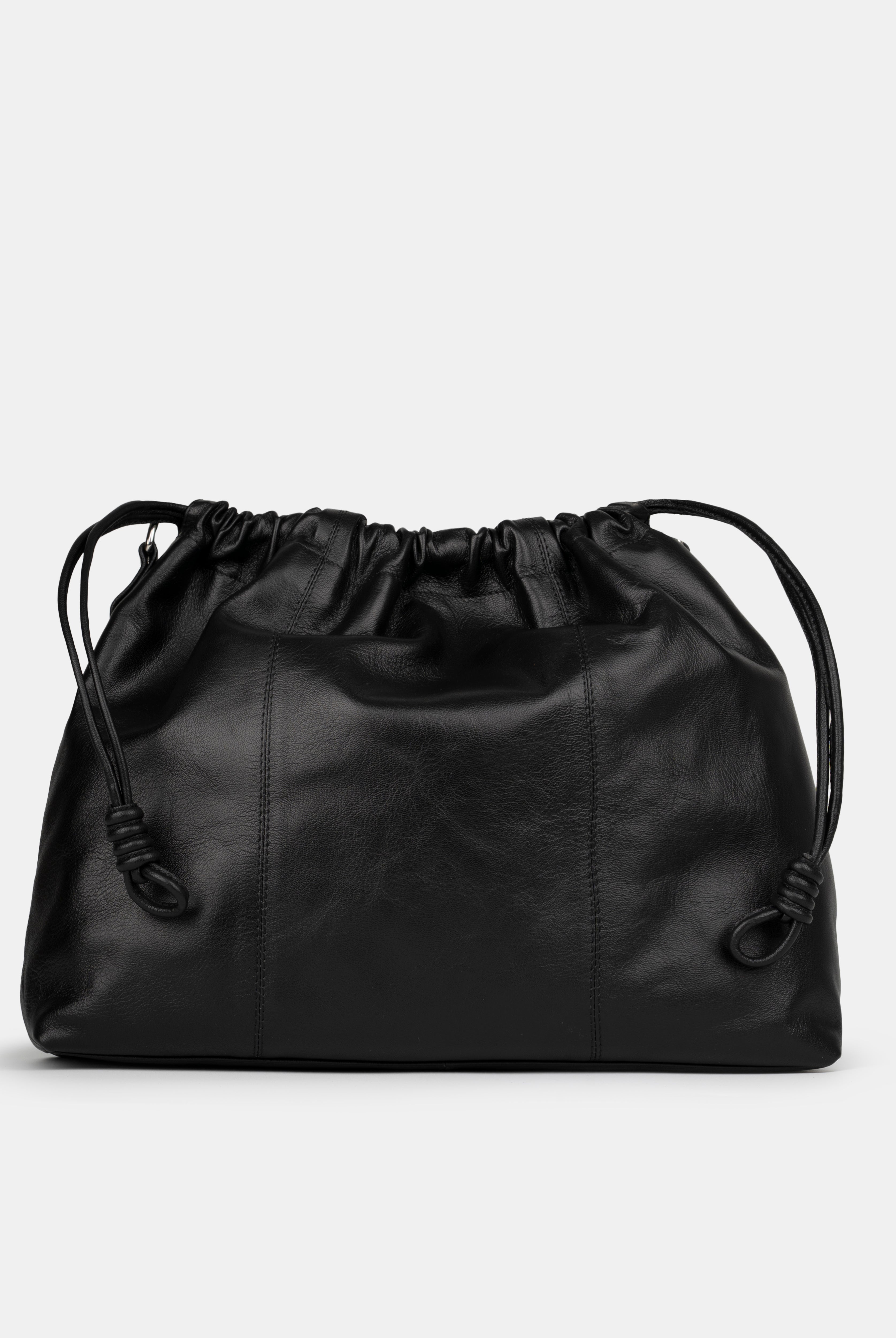 Black leather shoulder and crossbody bag with drawstring on a light gray background. Back Photo of Elliot Black Neuville
