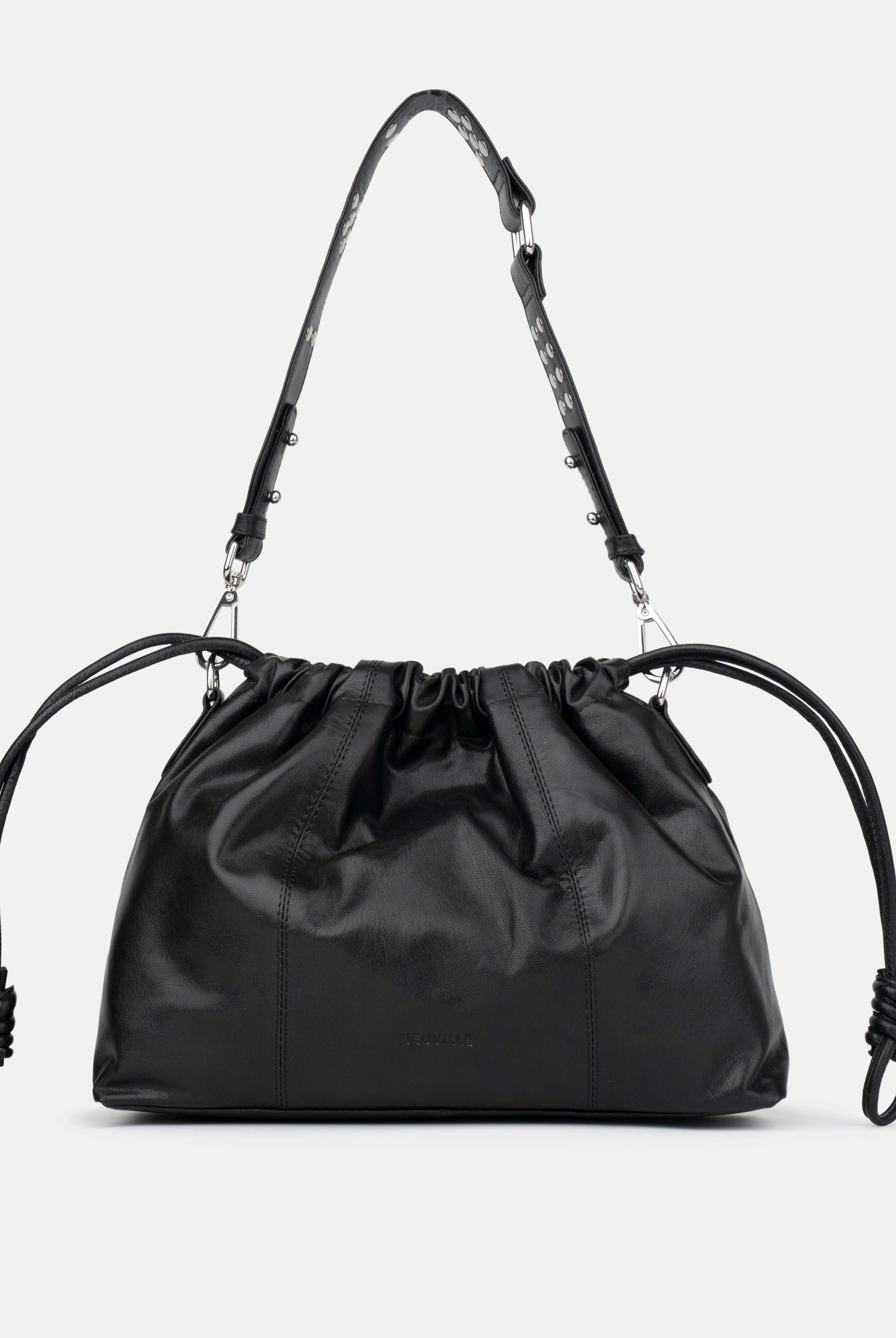 Black drawstring bag with adjustable strap on a light gray background