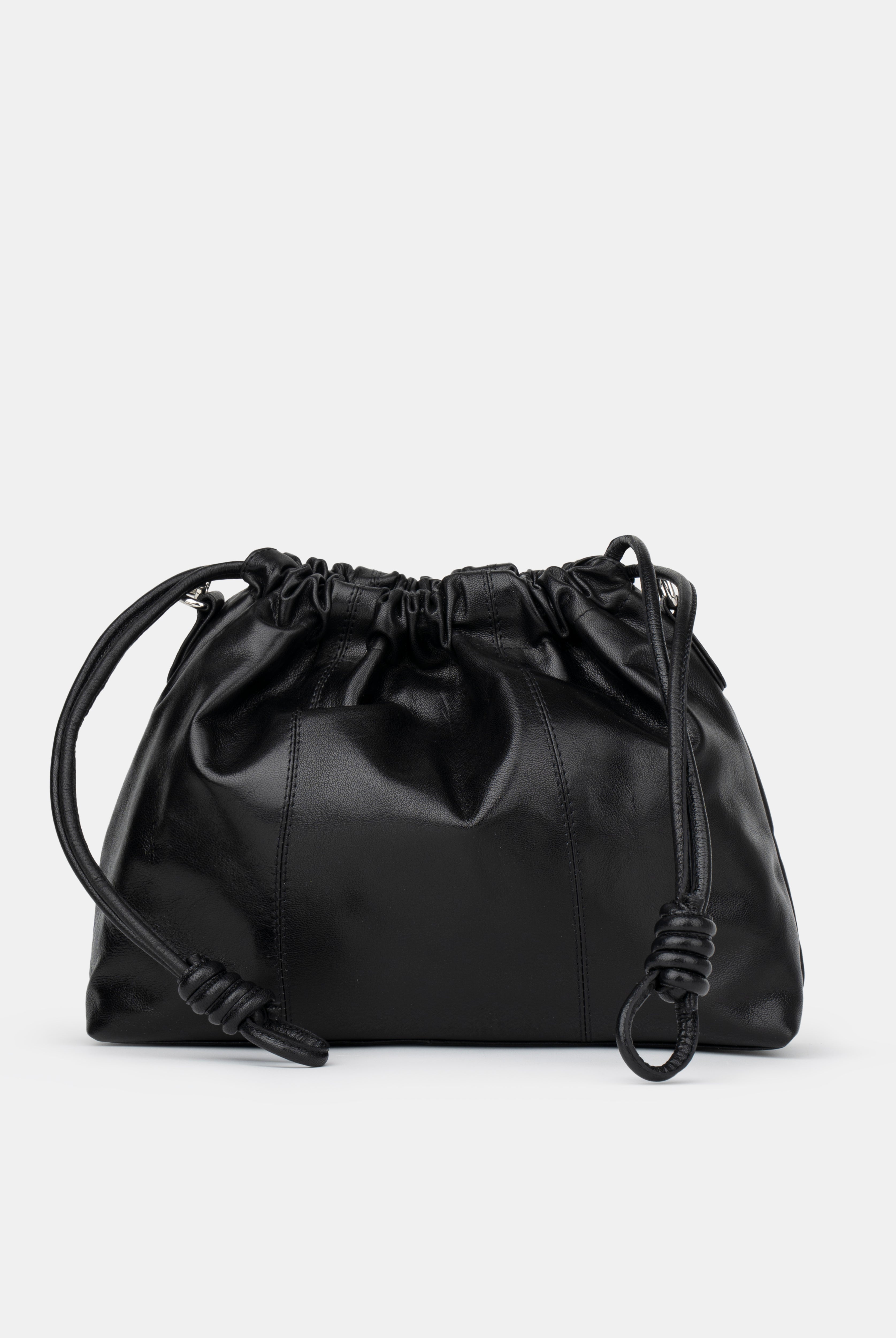 Black drawstring bag on a light gray background