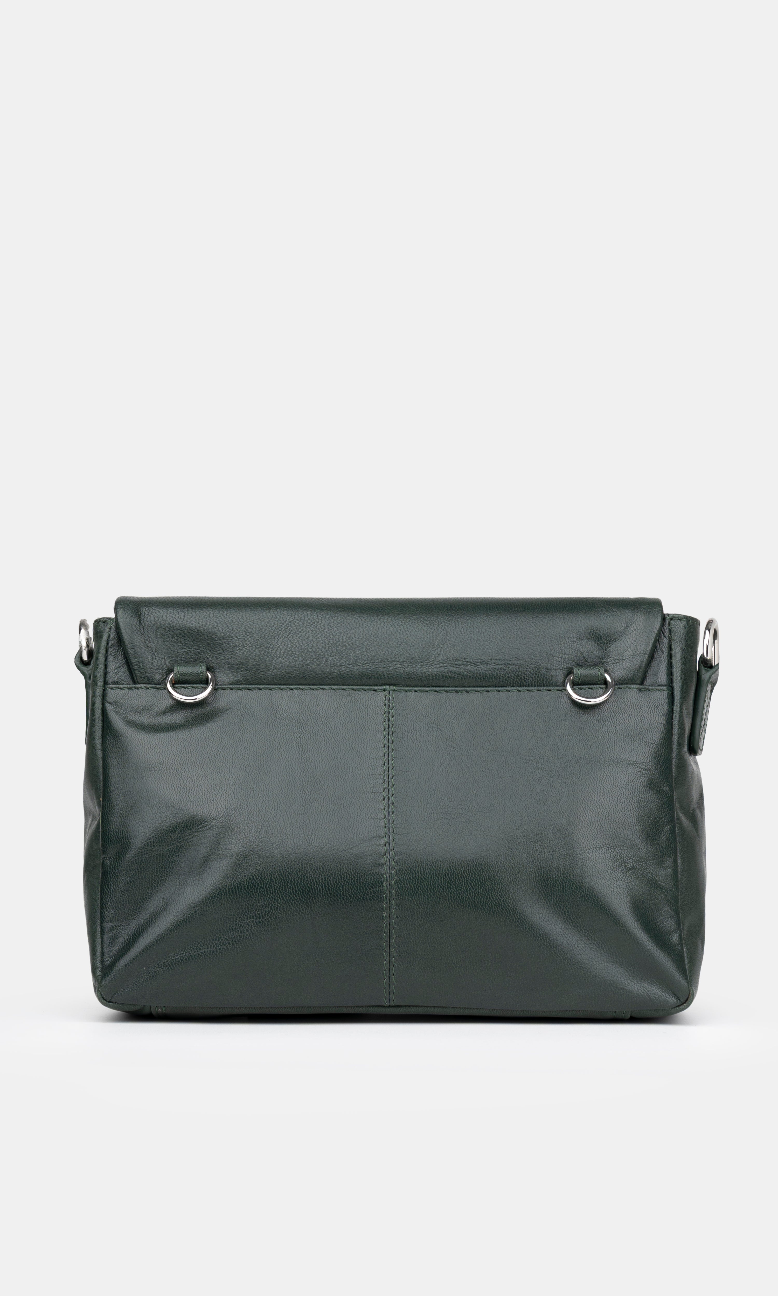 Dark green handbag on a light gray background