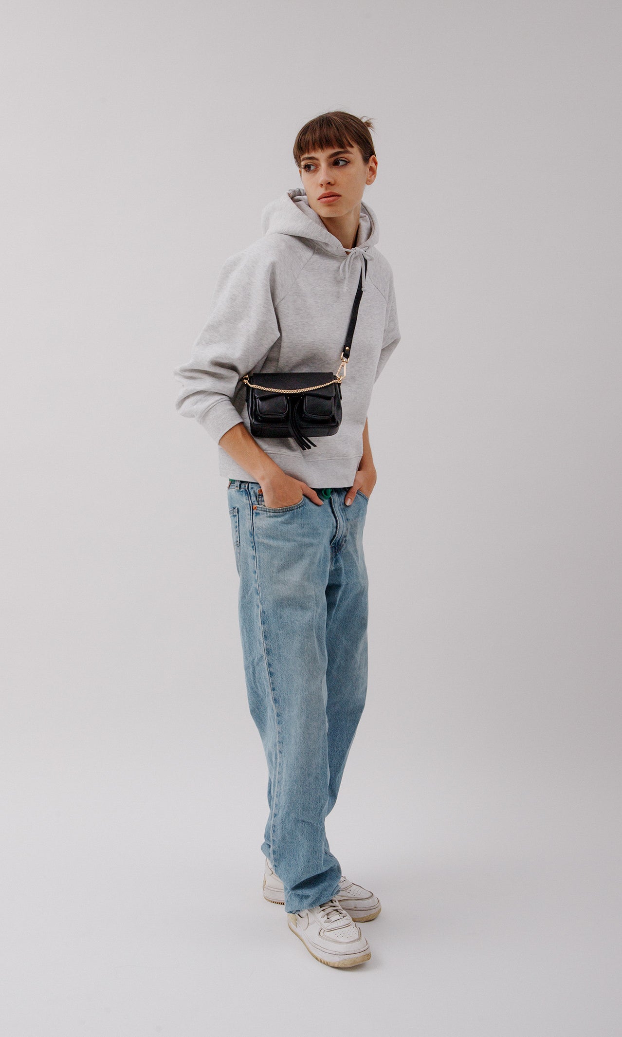 Max Mini Black with golden hardware, Leather bag worn as a crossbody bag.