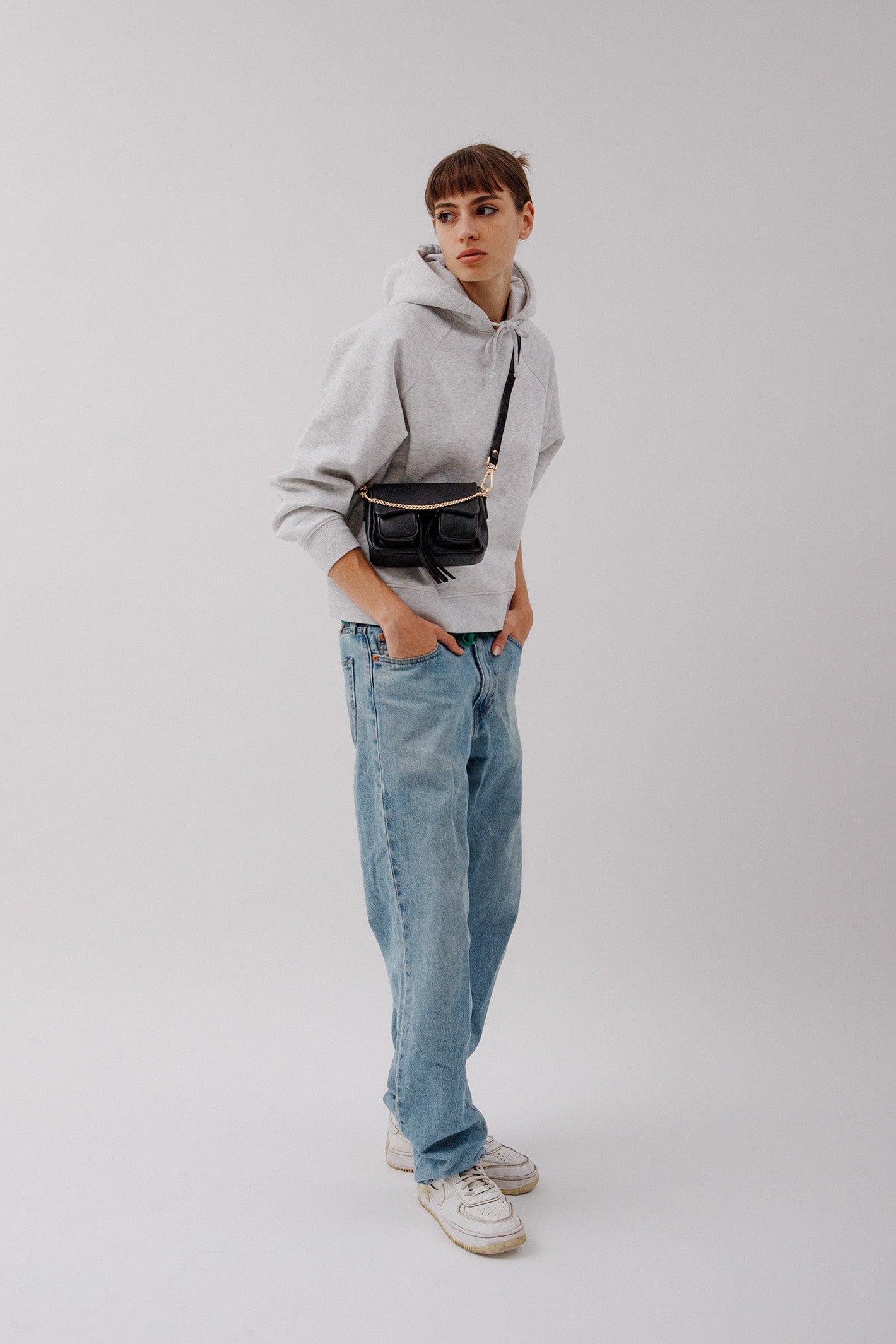 Max Mini Black with golden hardware, Leather bag worn as a crossbody bag.