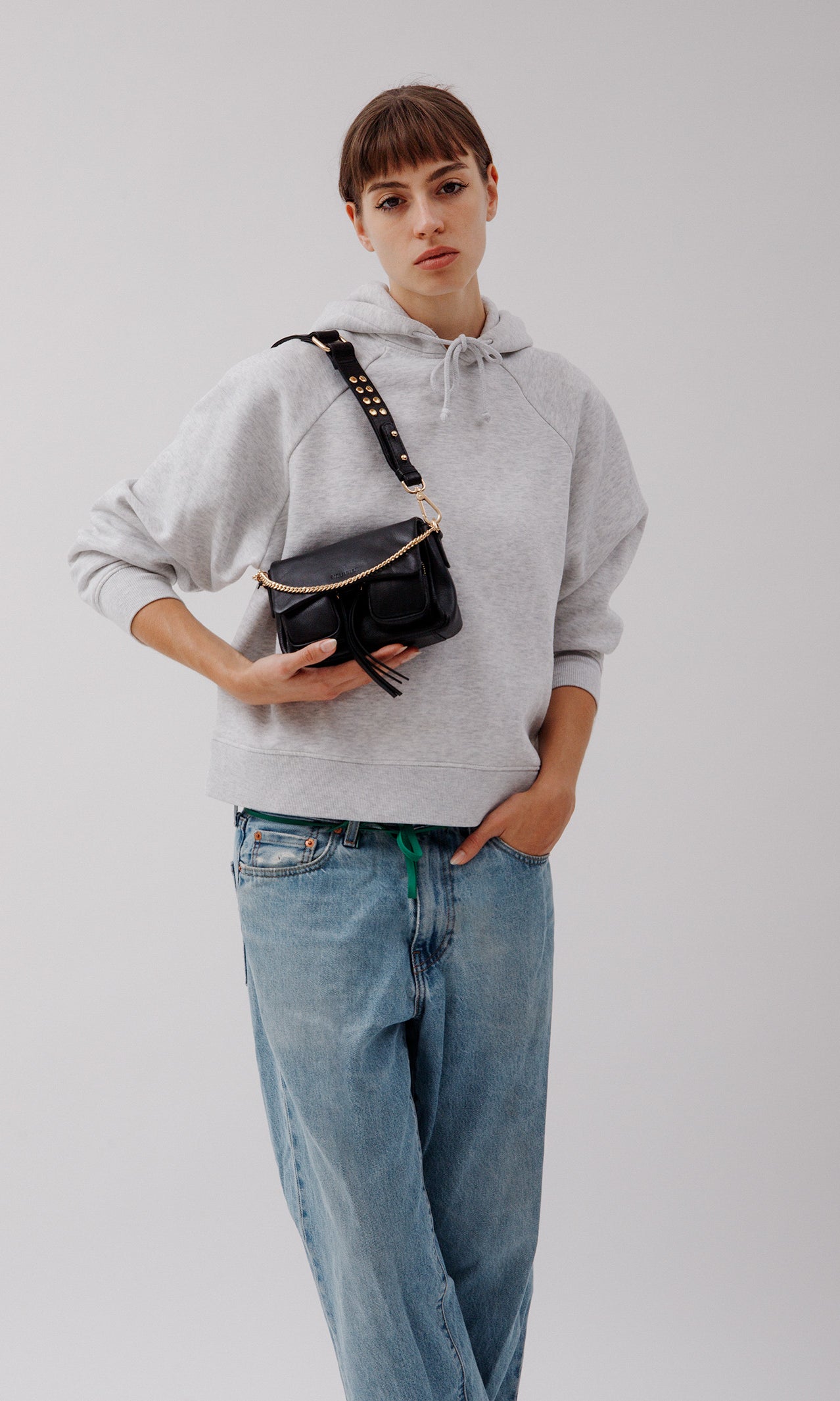 Max mini Black with golden hardware, on model worn as shoulder bag