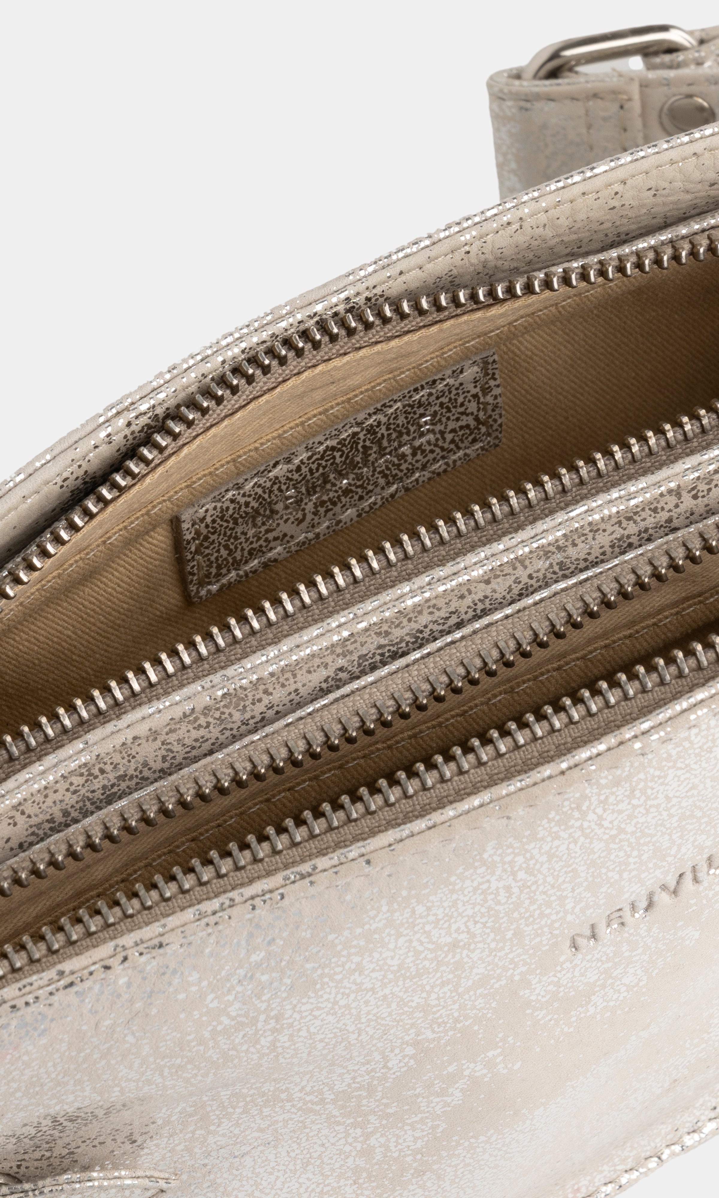 Close-up of a silver handbag with a visible brand logo on a white background