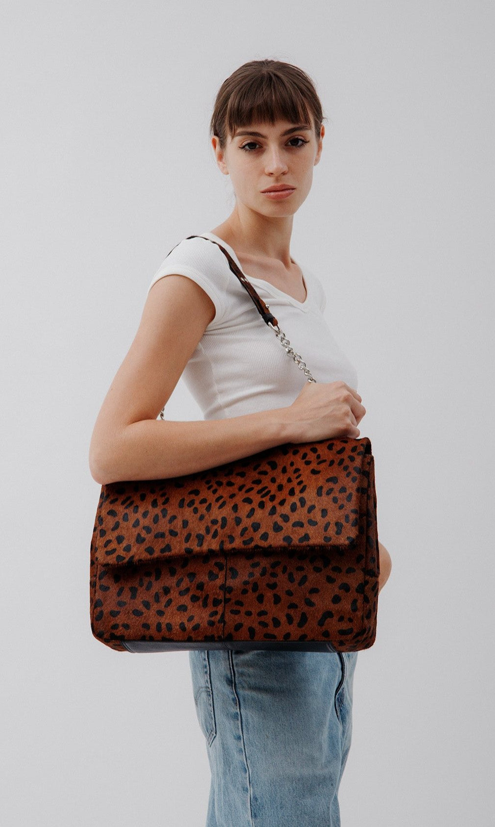 Rachel Leopard, leather shoulder bag in Leopard print on model