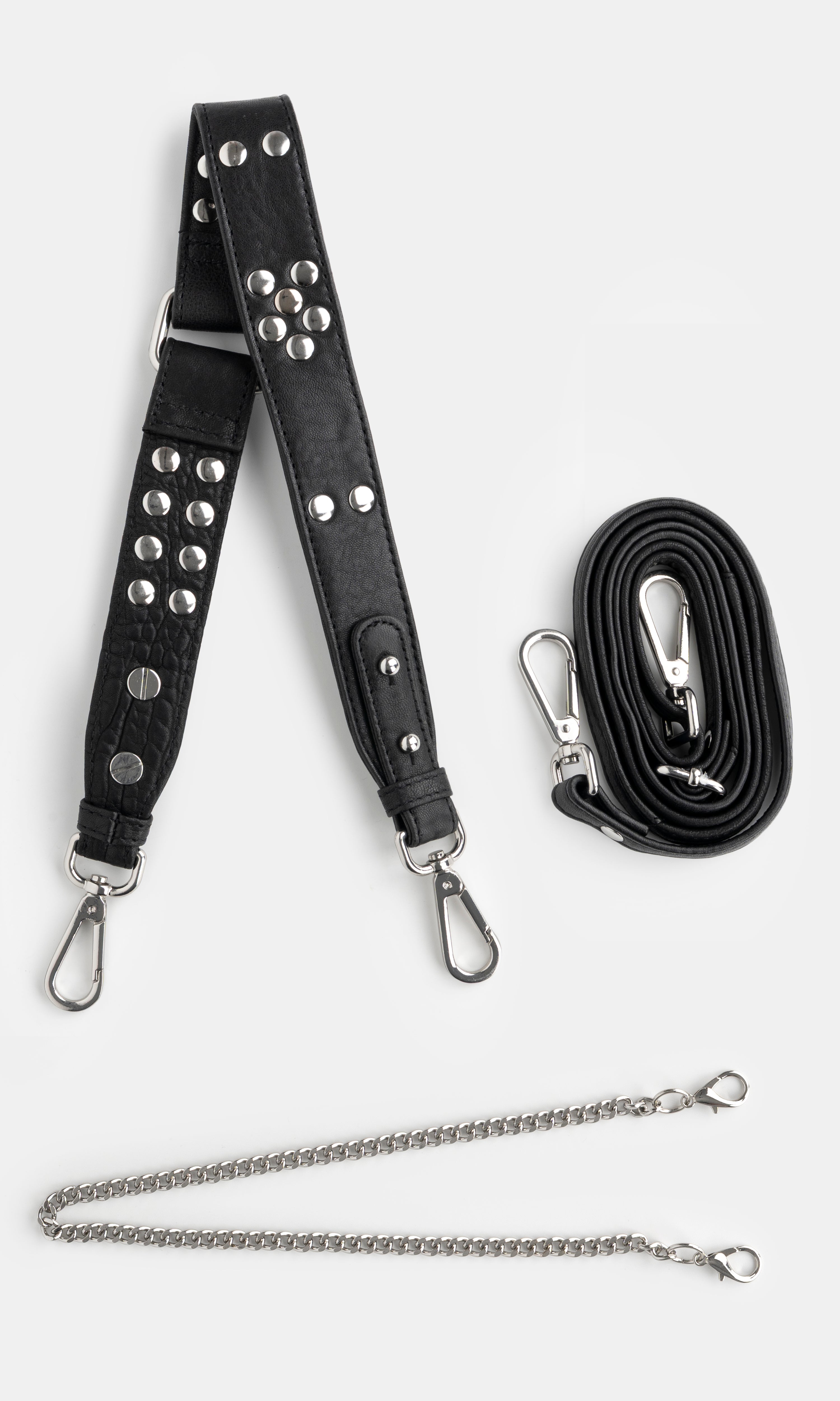 Black studded bag strap with silver hardware and a chain extension on a white background