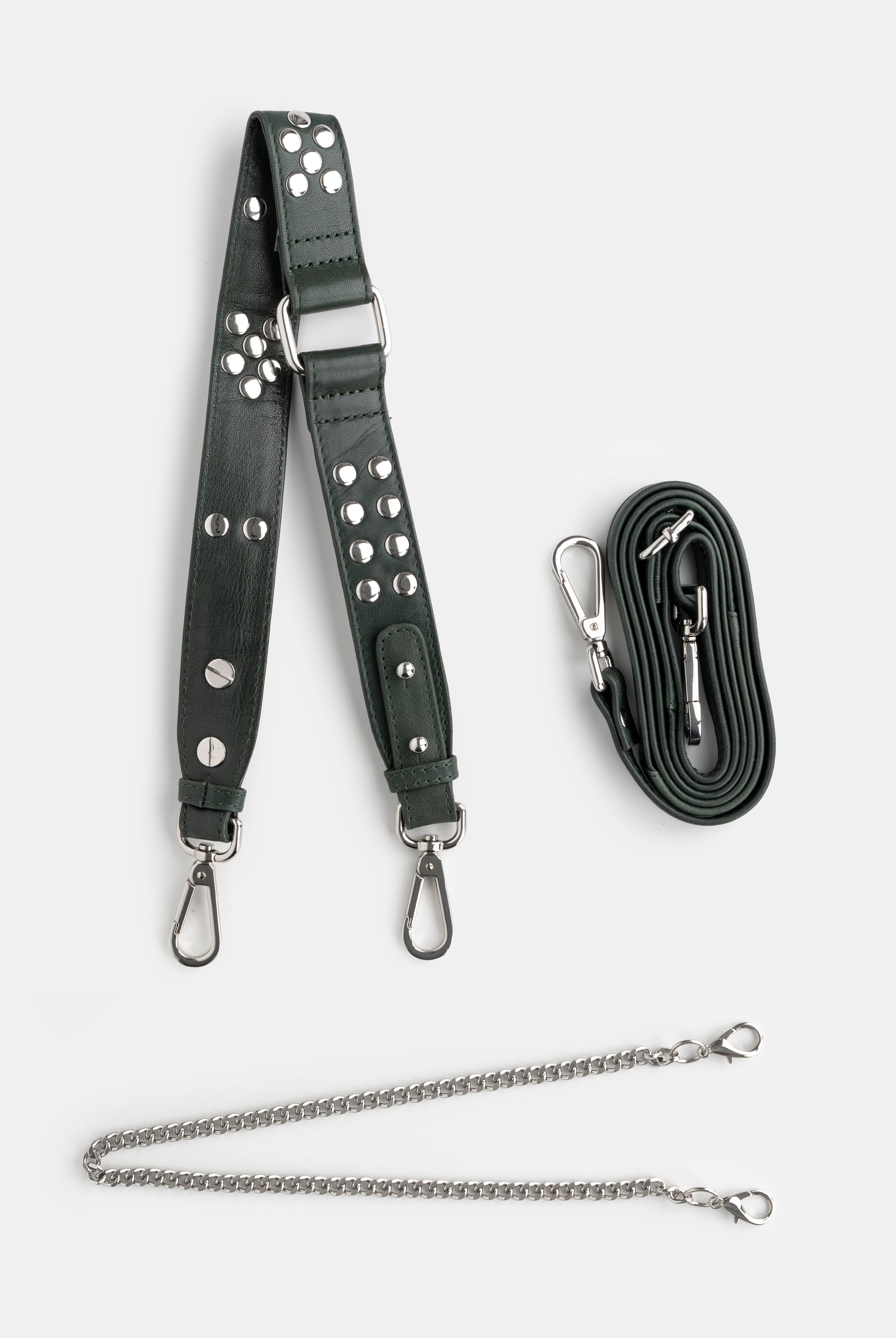 green leather strap with silver studs and hardware on a white background