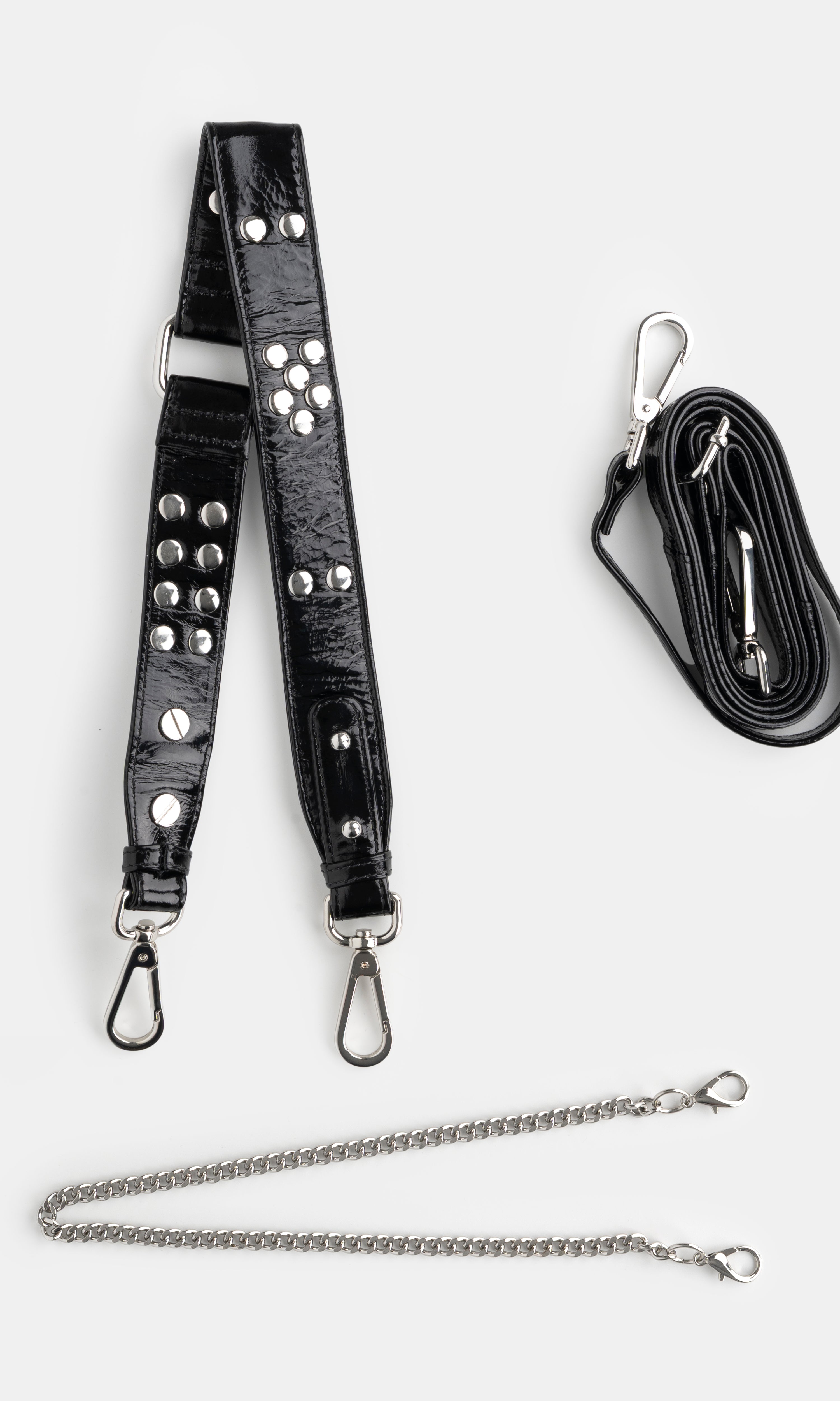 Black leather strap with studs and chain, and a black lanyard on a white background