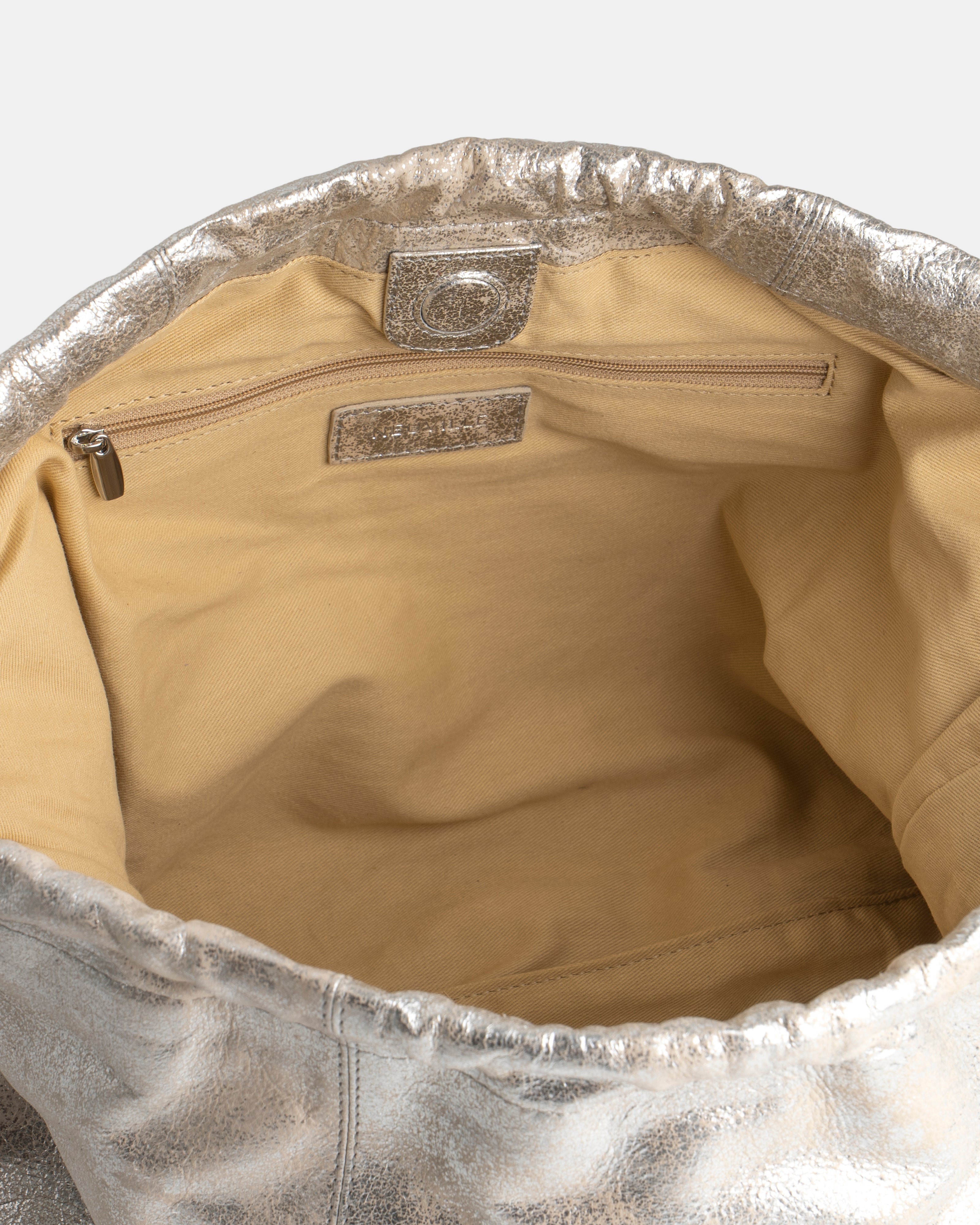 Detailed CLose-up of the inside of a Sand gold Leather shoulder bag. Elliot Sand Gold Neuville