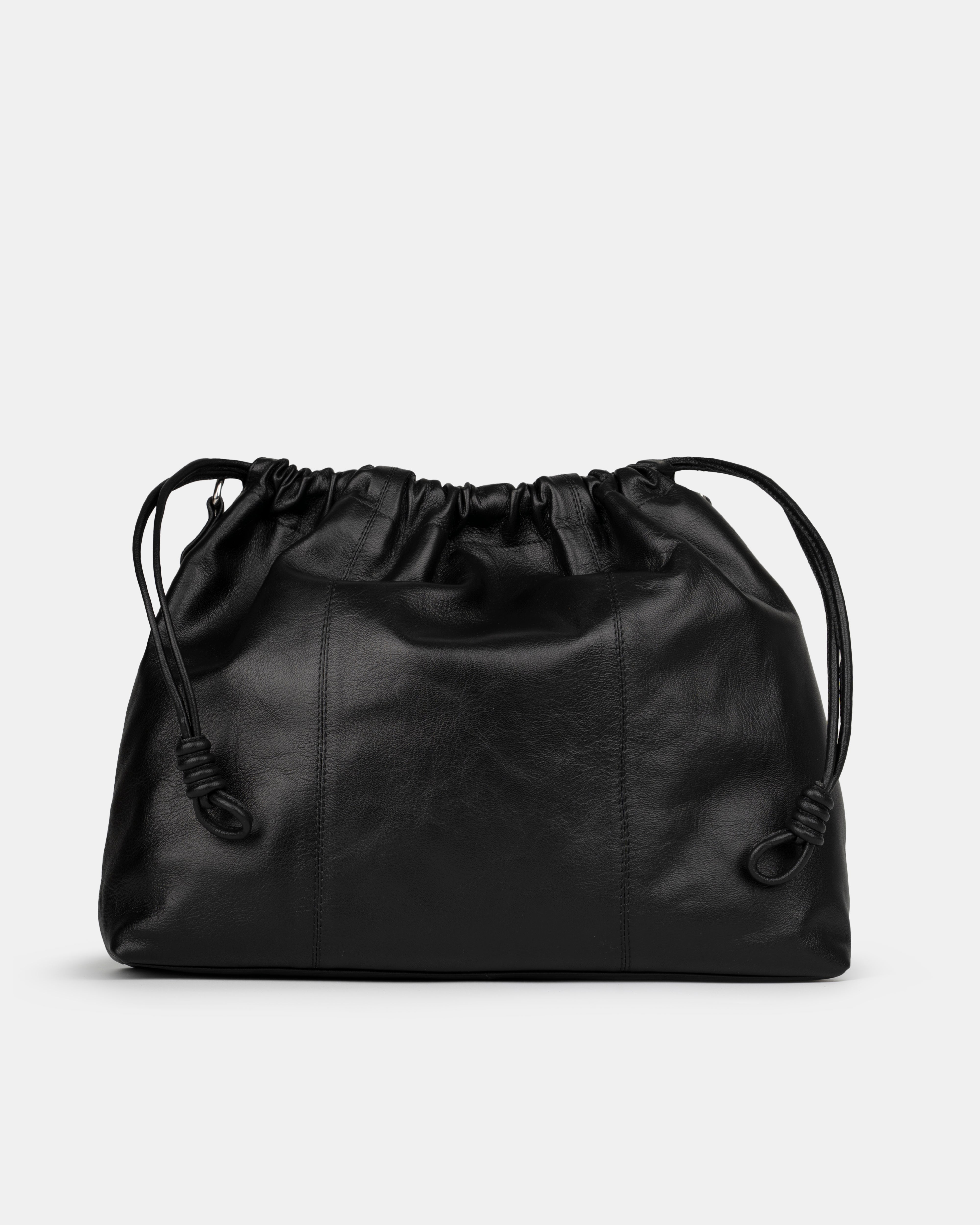 Black leather shoulder and crossbody bag  with drawstring on a light gray background. Back Photo of Elliot Black Neuville