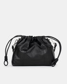 Black drawstring bag on a light gray background