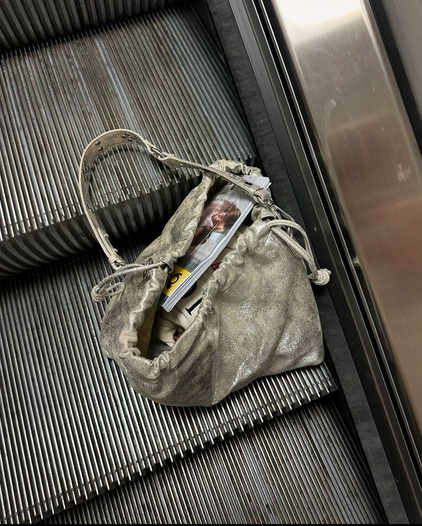 Elliot Sand Gold metallic drawstring bag. Neuville bag