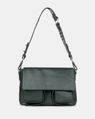 Green shoulder bag with a strap on a light gray background