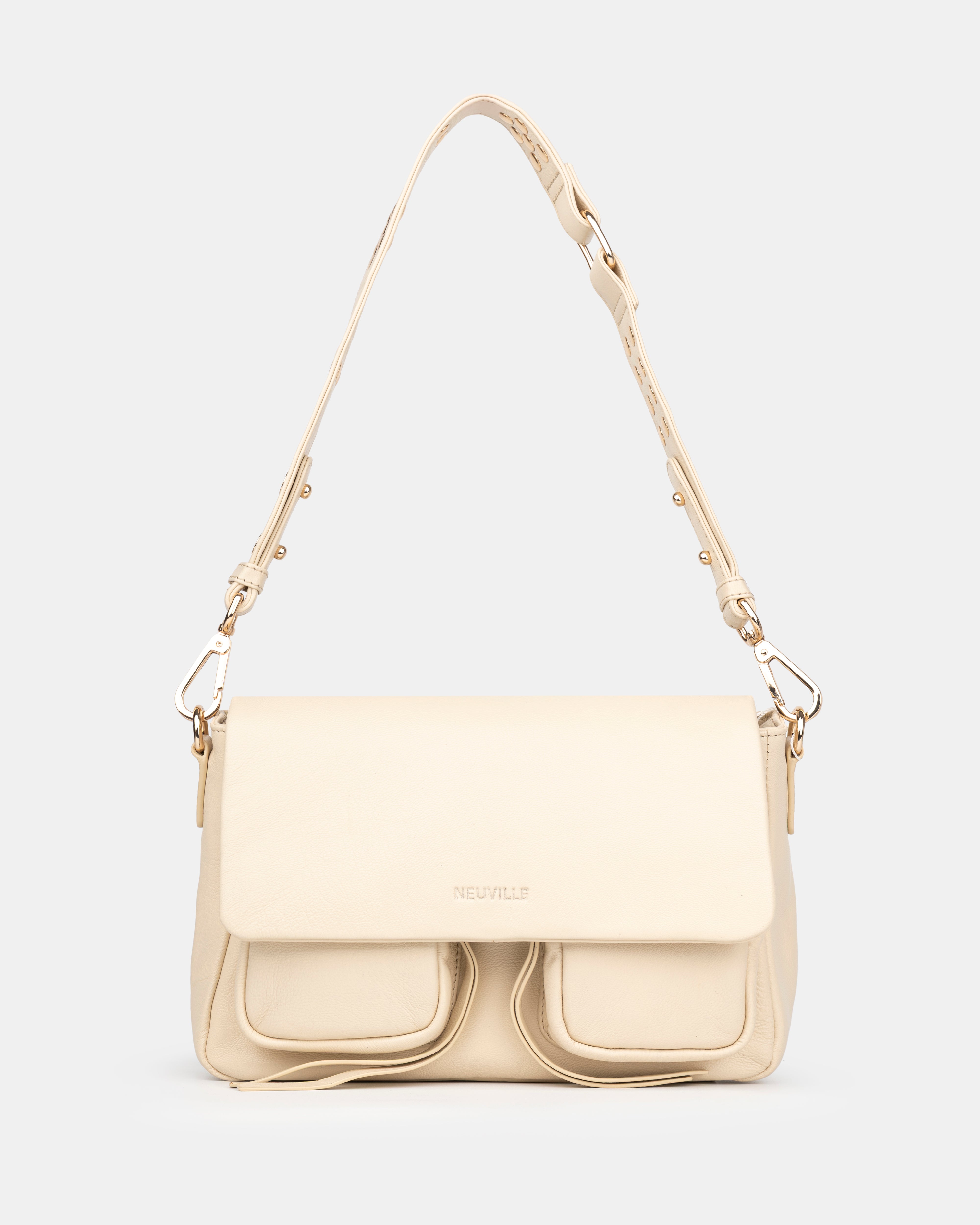 Beige handbag with a strap on a light gray background