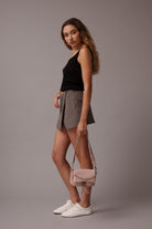 Max mini Light Pink Leather bag, worn by model in hand