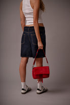 Maxke Red Coral, red leather bag with model