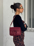 Maxke Burgundy leather bag on model