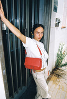 Maxke Red Coral, red leather bag with model