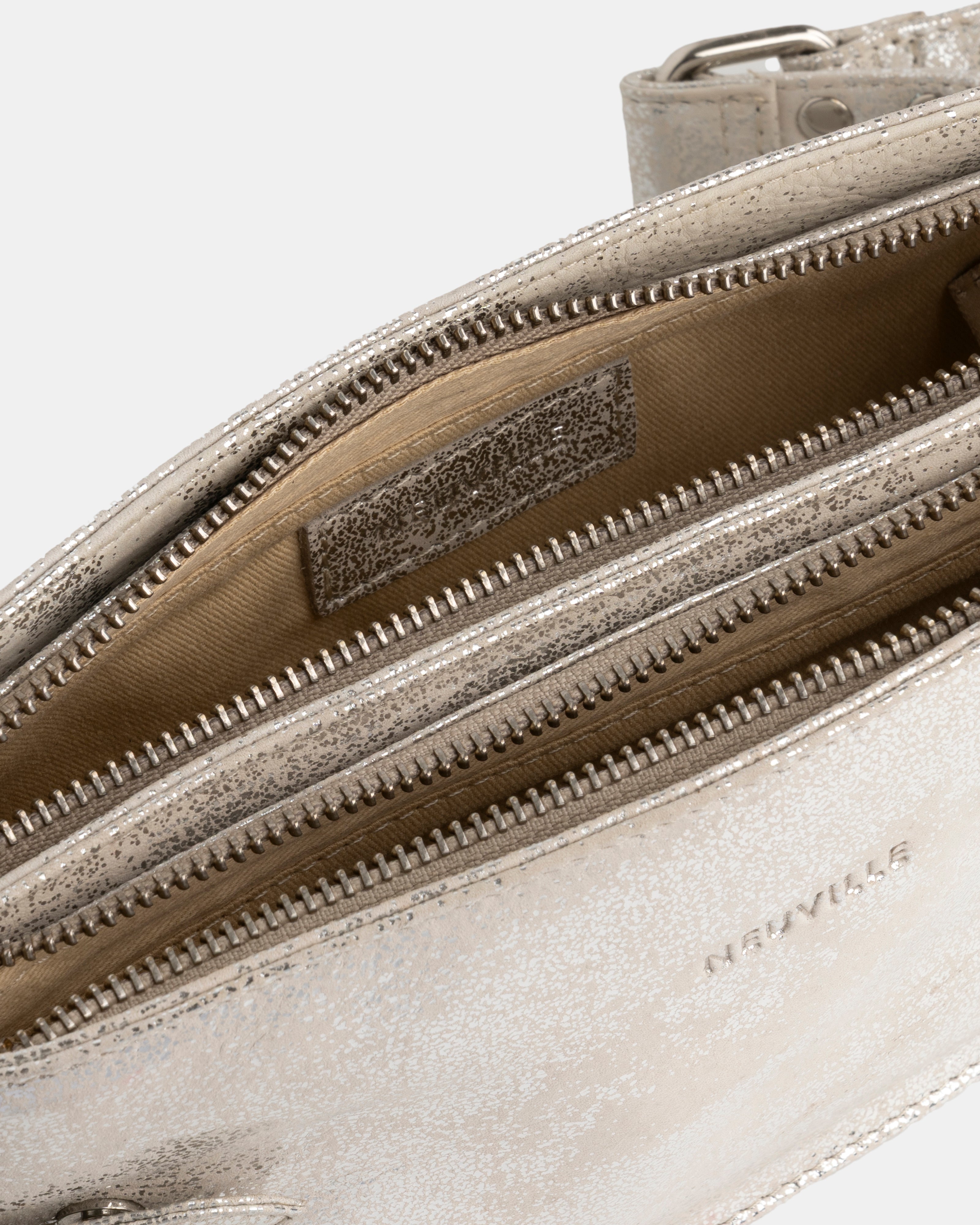 Close-up of a silver handbag with a visible brand logo on a white background