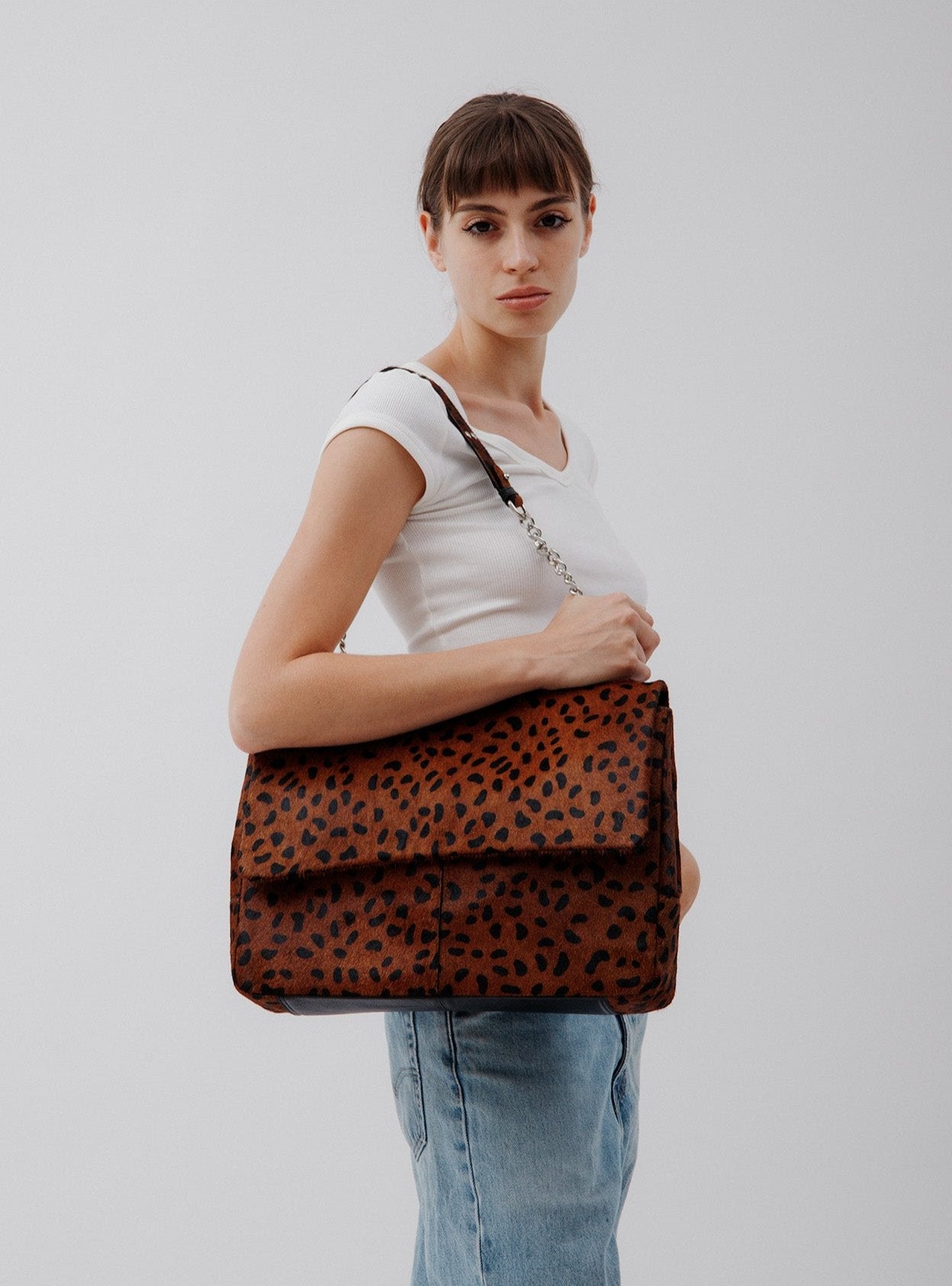 Rachel Leopard, leather shoulder bag in Leopard print on model