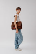 Rachel Leopard, leather shoulder bag in Leopard print on model