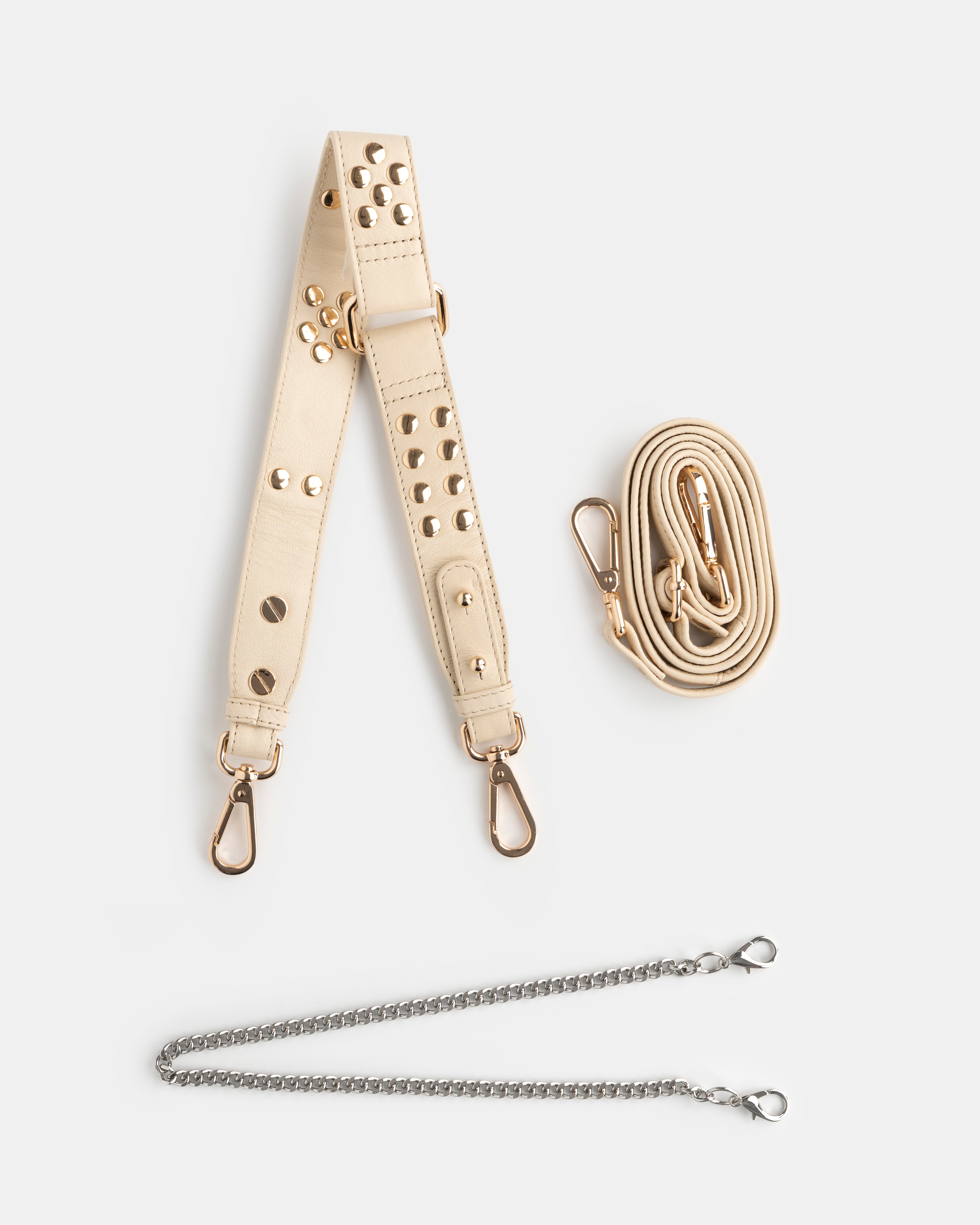 Beige leather strap with metal hardware and a golden chain on a white background