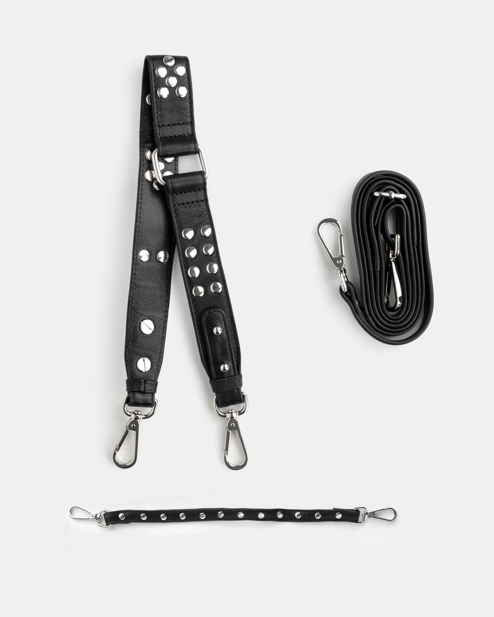 Three ways to wear it: a studded shoulder strap, an adjustable crossbody strap and a studded hand strap, all included.