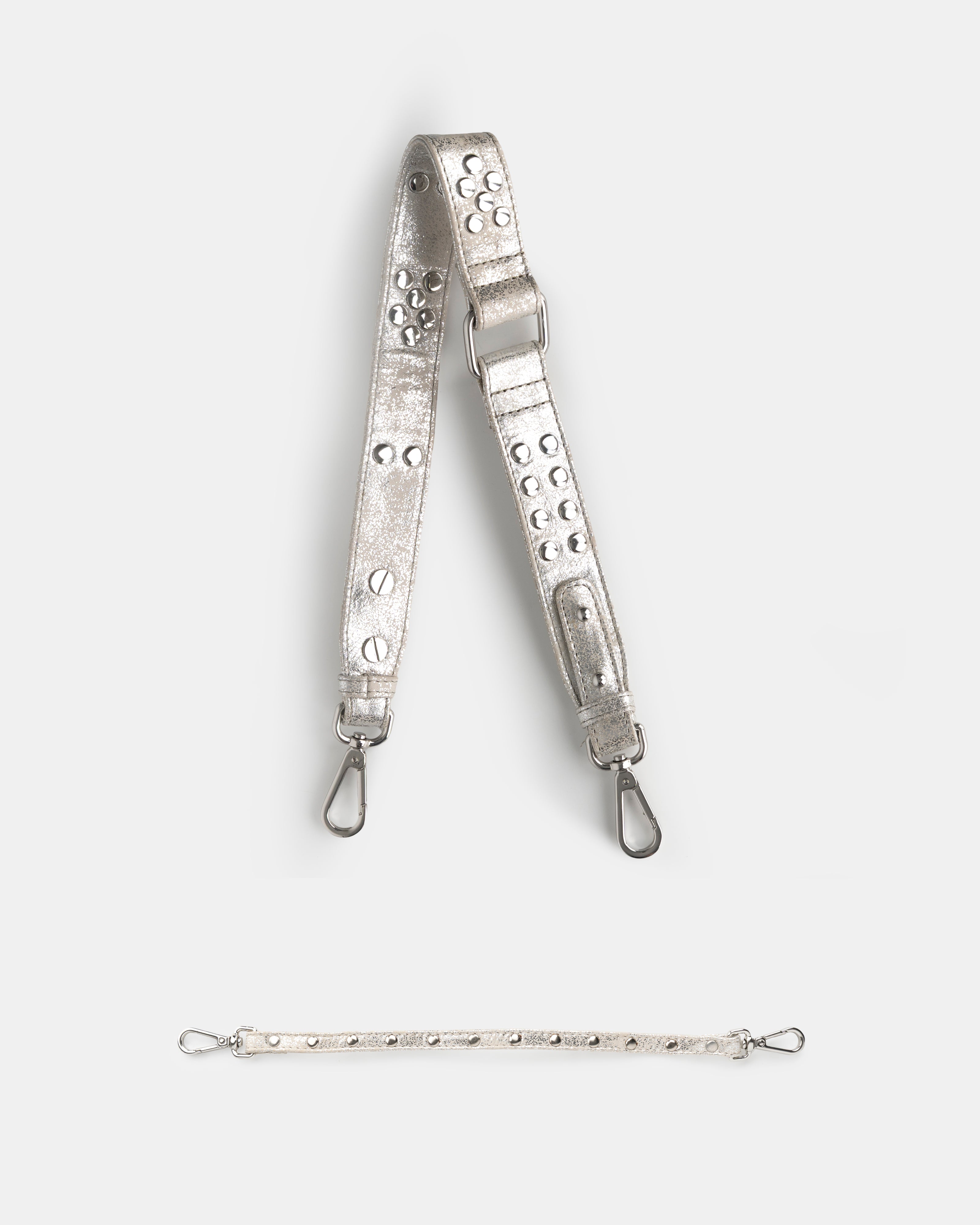 Metallic strap with decorative elements on a white background